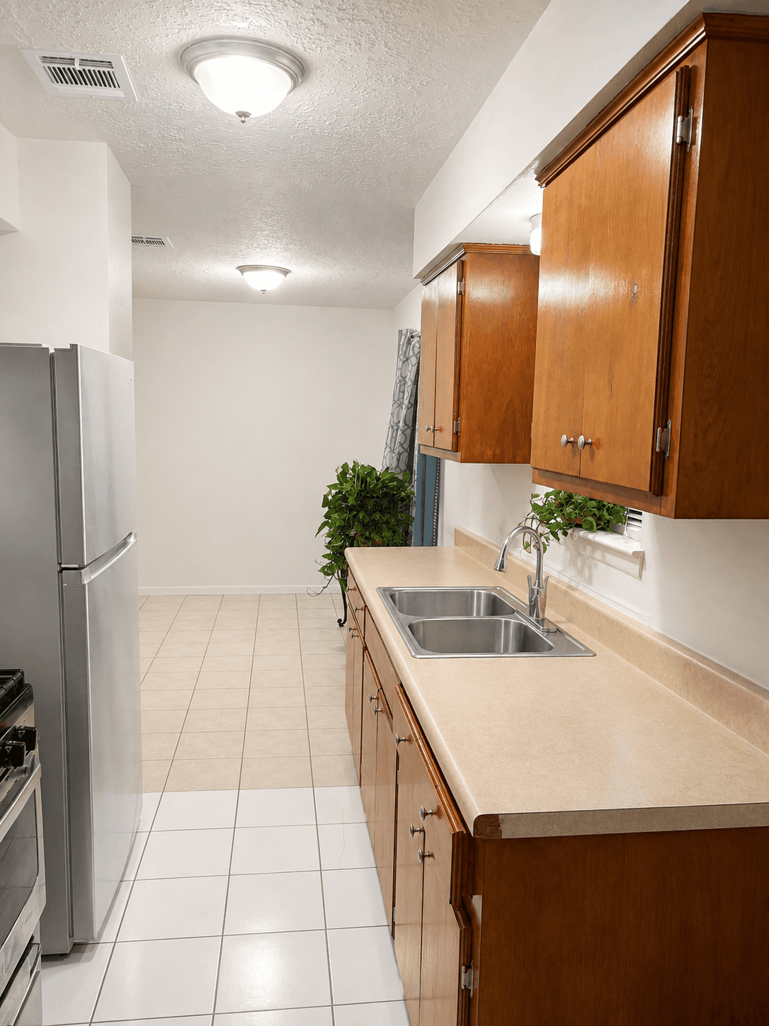 Residential kitchen with appliances and natural light